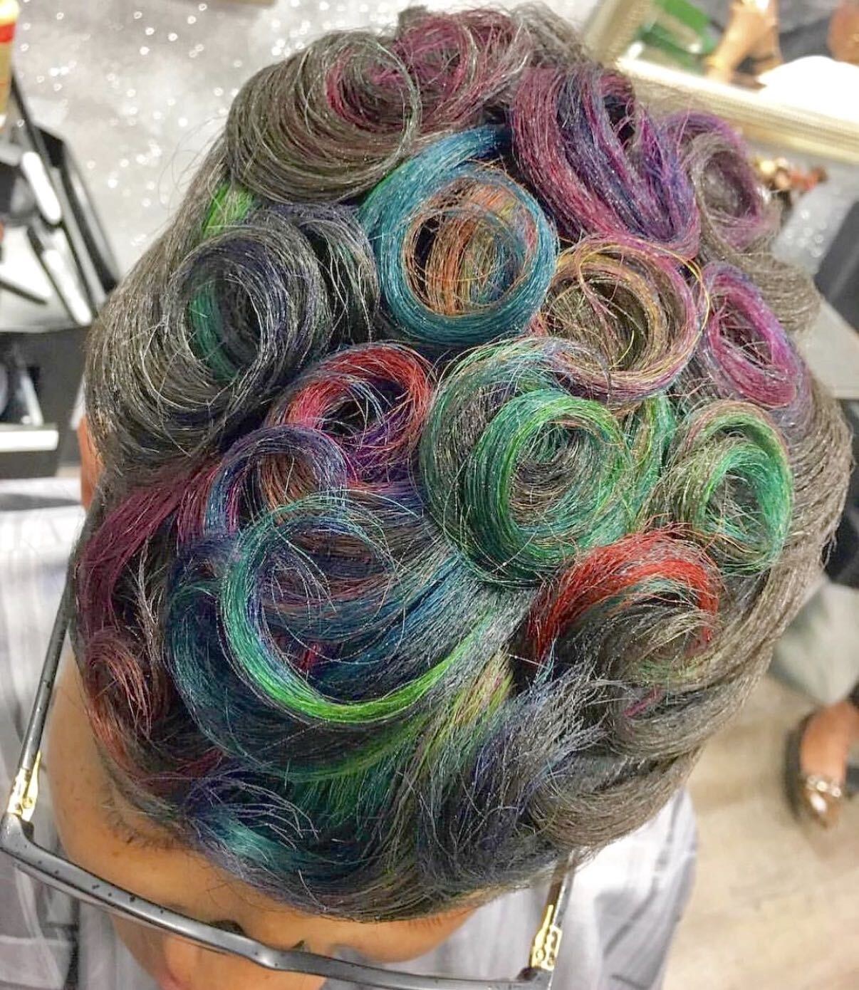 Short hair styled into sculpted pin curls with multicolor tints by Purpose